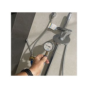 Testing a shower breach for leaks in Googong