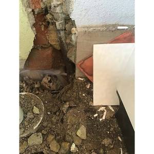leaking cold water pipe in the wall behind a laundry tub in Farrer Canberra