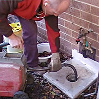 Cleaning drain blocked with grease in Canberra