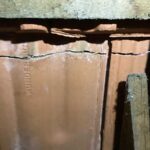 Crack in roof tiles under heavy solar hot water system looking from underneath Ainslie Canberra