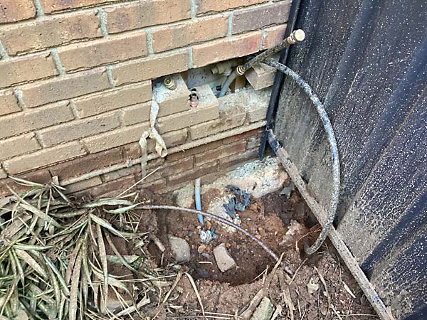 The polybutylene pipe in jerrabomberra was rubbing on the footings before entering the house through the brick work - The pipe should have been protected with a sleeve