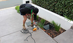 removing a sump pump from a stormwater pit in Woden Canberra